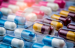 Blue-white capsule pills in blister pack. Pharmaceutical industry. Drug package. Pharmaceutics concept. Drug use in hospital.