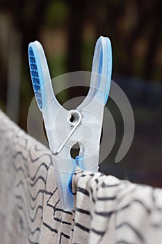 Blue and White Clothes peg on line