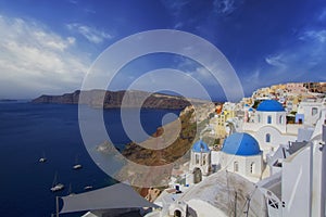 Blue and white colours of Oia City. Magnificent panorama of the island of Santorini Greece during a beautiful sunset in the Medite