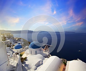 Blue and white colours of Oia City. Magnificent panorama of the island of Santorini Greece during a beautiful sunset in the Medite