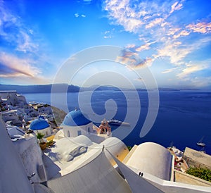 Blue and white colours of Oia City. Magnificent panorama of the island of Santorini Greece during a beautiful sunset in the Medite