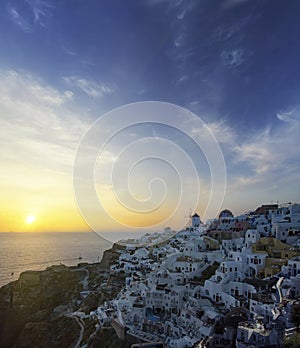 Blue and white colours of Oia City. Magnificent panorama of the island of Santorini Greece during a beautiful sunset in the Medite