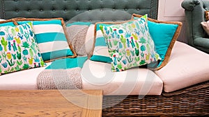 Blue and white cushions on a sofa as styled by interior designer