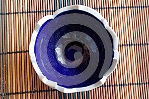 Blue - white empty cracked candlestick, top view