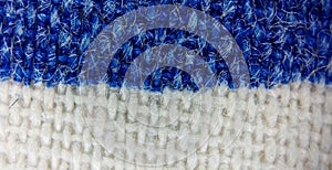 blue and white fabric texture in a microscope