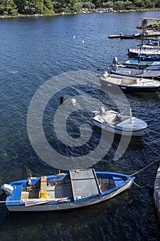 Blue and white fishing boats over dark water. Ston, Croatia