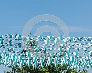 Blue and white flags, blue sky, New York