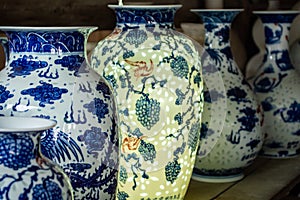 Blue and white glazed porcelain vases on a shelf