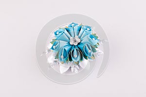 Blue and white hair clip in the shape of a flower