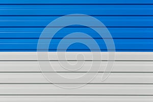 Blue and white horizontal lines sheet metal plate corrugated texture steel fence background