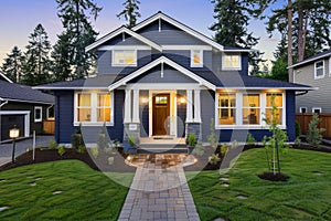 A blue and white house with a large lawn and trees in front