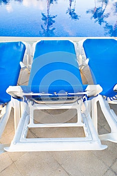 Blue and white lounges near pool