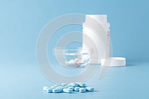 Blue and white medicine tablets antibiotic pills.