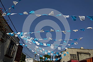 Blue and White Mexican bunting Papel Picado against a blue sky Mexico