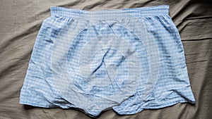 Blue and white mini pant on bed