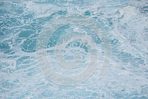 Blue white ocean surf swirling water ideal as aquatic background