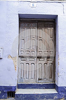 Blue and White Old Door of a House in a Village in Spain