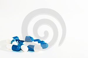 Blue white pills capsul on white background.