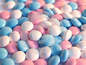Blue, white and pink pills