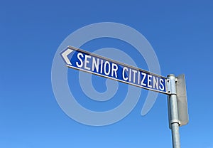 Blue and white senior citizens sign pointing