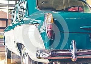 Blue and white shiny retro vintage car rear view