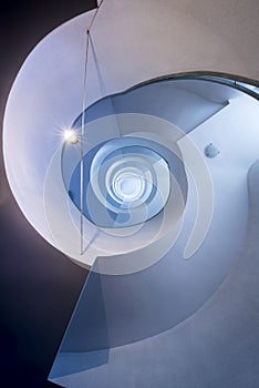 Blue and white spiralling stairs