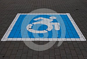 Blue and White Square Symbol Of Handicap Parking