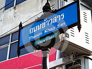 A blue and white street sign at famous Thanon Khao San Road in Bangkok, Thailand