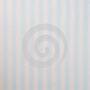 Blue and white striped pattern on mulberry paper textured background, detail close-up