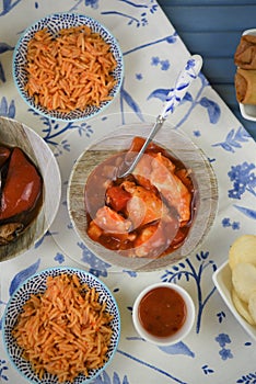 Blue and white table flat lay with rice and chicken dishes ready to eat