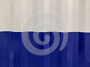 Blue White Textured Abstract background of bend tin shed