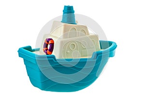 Blue and white toy boat with lifebuoy