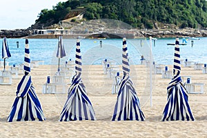 Blue and white umbrellas of Ondarreta beach, San Sebastian, Spain