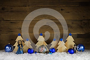 Blue and white wooden christmas background with snow for decoration.