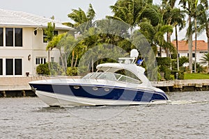 Blue and White Yacht in Canal