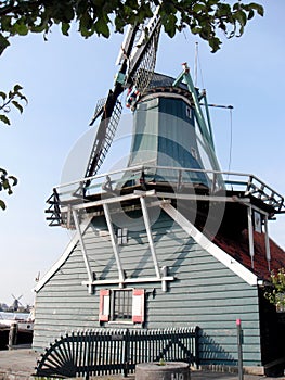 Blue windmill which was put on a residential house photo
