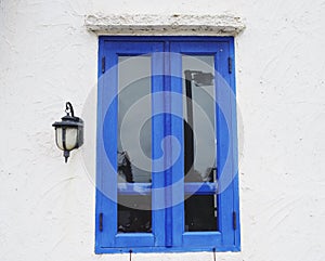 Blue window against clear white wall