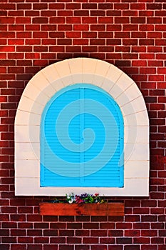 Blue window and old red brick wall vintage style,door with design arch on wall and backdrop