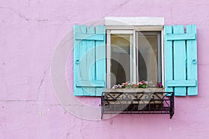 Blue window on the pink wall with space