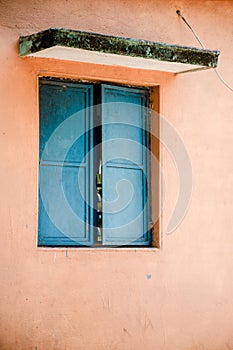 Blue window on the pink wall with space