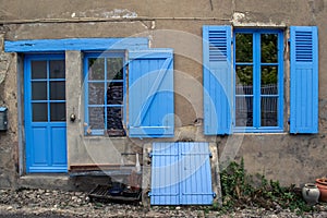 Blue windows and door on a village house
