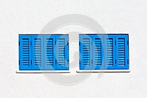 Blue windows on the white wall