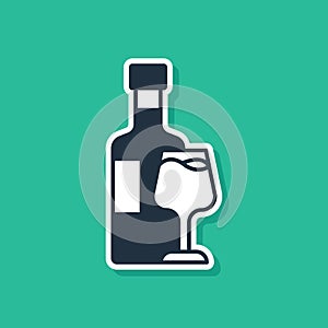 Blue Wine bottle with glass icon isolated on green background. Vector