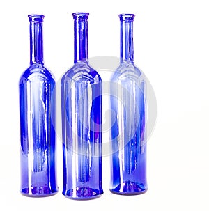 Blue wine bottles still life with colourful background