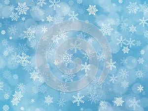 Blue winter boke background with snowflakes