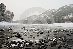 Blue winter mountain misty river. Snow frozen pine trees. Travel day Frost winter season