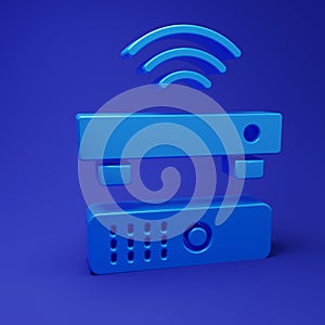 Blue Wireless multimedia and TV box receiver and player with remote controller icon isolated on blue background