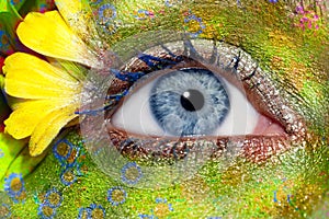 Blue woman eye makeup spring flowers metaphor