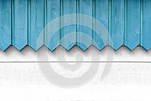 Blue wood decoration in front of white wall