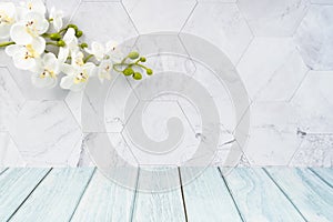 The Blue wood floor and white wall with white orchid decorate, empty room for background
